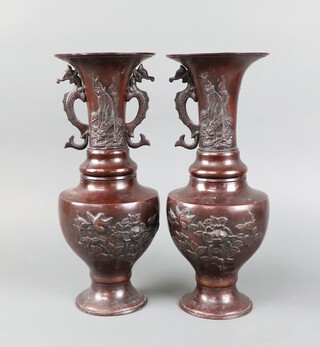 A pair of 19th Century Japanese bronze twin handled vases of club form 35cm 