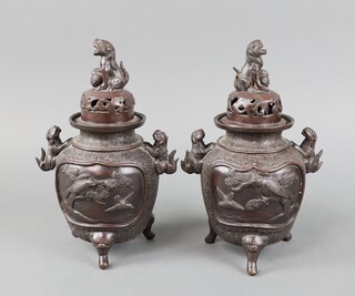 A pair of 19th Century Japanese twin handled bronze Koro decorated with panels of birds 20cm x 18cm 