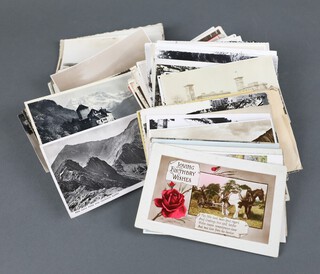 A collection of various black and white and coloured postcards 