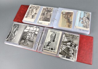 Two brown albums of black and white and coloured postcards 