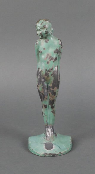 A verdigris metal figure of a standing lady, the base marked Eve British Made 22cm x 8cm x 5cm 