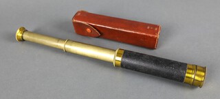 A 3 drawer pocket telescope contained in a leather case 