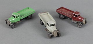 Dinky Toys, two 25A Wagons Type 2 1936-40 - one in green, one in maroon, smooth hubs, together with a 25E Tipping Wagon with type 2 chassis in grey  