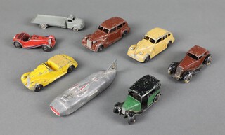 Dinky Toys, a 39A Packard Super 8 Tourer in brown with smooth hubs and silver base plate, a 39D Buick Viceroy Saloon with beige body and black ridged hubs, a 36C Humber Vogue in brown and black, white tyres and smooth black hubs, a 38B Sunbeam Talbot Sport (missing windscreen) in yellow with faun tonneau, a 36G taxi with driver in dark green, filled rear windows, a 38F Jaguar sports car with red body and maroon interior, ridge hugs and unpainted base plate, a 23S Streamlined Racing Car (late 40's) in silver with red flashes and a Dublo Dinky 66 Bedford flat truck in grey  