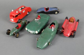 Four Merritt plastic racing cars together with a Merritt fire engine and a Cowland and Cowland Jaguar 