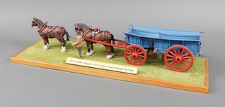 A scratch built 1870 Sussex wagon together with 2 horses and farm hand displayed on a wooden plinth and grass diorama, cased  44cm l x 8cm w 