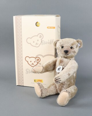 A modern pale brown Steiff 1908 replica mohair bear, black button eyes, growler and ear button 408007 32cm, boxed with certificate.