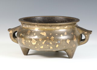 A 17th/18th Century Chinese bronze and gold splashed twin handled censer with impressed 6 character Ming dynasty Xuande mark to base, of squat bulbous form raised on tripod supports, 7cm h x 19cm diam