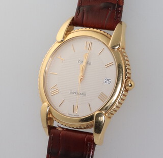 A gentleman's Concord 18ct yellow gold cased calendar quartz wristwatch the dial inscribed Impresario, the case marked 50-C2-212 1094880, contained in a 35mm case with a leather strap  