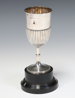 A Victorian silver demi fluted cup with wooden socle, London 1882, 104 grams, 14cm 