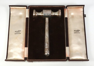 An Indian white metal gavel engraved "Presented to Lady Fitzherbert as a memento of the launching of the Royal Indian Navy's M.S. trawler Travancore at Garden Reach Workshops on 7th July 1941" 17cm, 235 grams, contained in a fitted case  