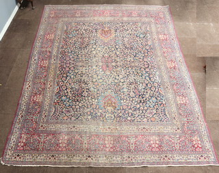 A North Persian blue and white patterned floral carpet with multi row border 384cm x 298cm 