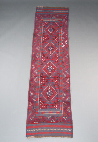 A red and blue ground Meshwani runner with 4 diamonds to the centre 248cm x 63cm 
