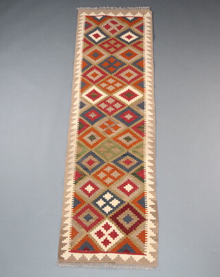 A tan, black and brown ground Maimana Kilim rug with all over geometric design 210cm x 62cm 