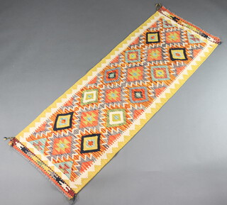 A white, yellow and green ground Chobi Kilim runner with overall geometric design 198cm x 70cm  