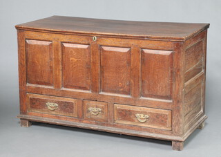 A 17th/18th Century oak mule chest with hinged lid and iron lock and brass escutcheon, the base fitted 1 short and 2 long drawers with replacement brass swan neck drop handles, raised on square feet 80cm h x 136cm w x 58cm d 