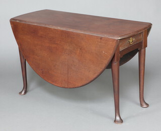 A Georgian mahogany oval drop flap dining table, fitted a frieze drawer, raised on club supports 71cm h x 121cm x 45cm 