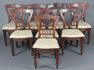 A set of 8 Victorian carved walnut bar back dining chairs, the mid rail with bobbin turned decoration 88cm h x 43cm w x 40cm d 