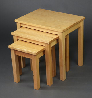 A nest of 3 light oak interfitting coffee tables on square supports 51cm h x 54cm w x 40cm d (contact marks in places)