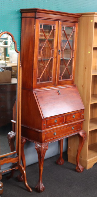 A Georgian style mahogany bureau bookcase with moulded cornice, fitted shelves enclosed by astragal glazed panelled door, fall front above 2 short and 1 long drawers, on cabriole supports 185cm h x 73cm w x 37cm d (in 3 sections) 