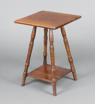 An Edwardian square oak 2 tier occasional table on turned supports 59cm h x 40cm 
