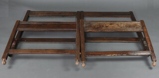 A pair of oak single panel end bedsteads formed from old timber, complete with side irons, 97cm x 92cm  