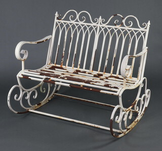 A white painted metal rocking garden bench 97cm h x 110cm w x 92cm d (some paint loss) 