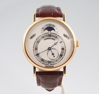 A gentleman's 18ct yellow gold Breguet 4354 moonphase wristwatch, with day and date apertures, seconds at 6 o'clock and an engined turned silver dial, the 40mm case numbered 7337 4354 AM the movement numbered 47492 on a brown leather strap with 18ct yellow gold clasp, with original walnut box, outer box, guarantee, pamphlet, bill of sale 2011, original tag and gold screwdriver  