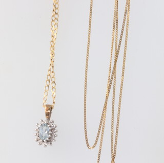 A yellow metal topaz and diamond pendant on a ditto necklace, 42cm, a ditto necklace 43cm, gross weight 3.2 grams