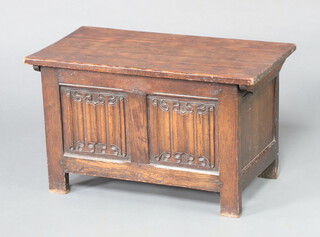 A 1930's oak coffer with hinged lid and linenfold decoration 45cm h x 76cm w x 40cm d 