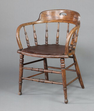 A 19th Century elm tub back chair with spindle turned decoration, raised on turned supports 75cm h x 58cm w x 45cm d 