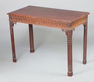 A George III rectangular mahogany side table with carved apron raised on square supports 79cm h x 106cm w x 54cm d 