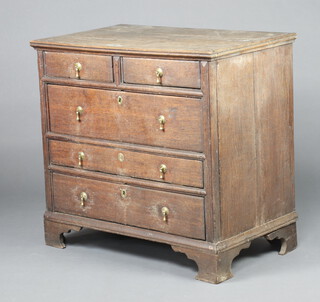 An 18th Century oak chest of 2 long and 3 graduated drawers, raised on bracket feet 85cm h x 89cm w x 55cm d 