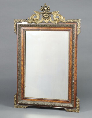 A 19th Century Continental mirror contained in a simulated walnut and gilt painted frame surmounted by a basket of fruit 133cm x 85cm 