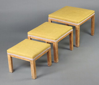 Parker Knoll, a nest of 3 square stools, the seats upholstered in mustard material 39cm h x 48cm w x 47cm d 