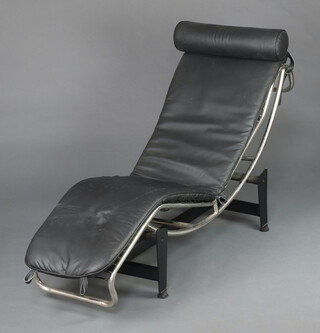 In the manner of Le Corbusier, a tubular chrome and iron lounger with black leather upholstery 63cm h x 163cm l x 46cm w