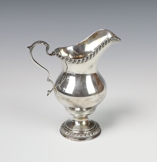 A silver Georgian style cream jug with S scroll handle London 1966, 14cm, 288 grams 