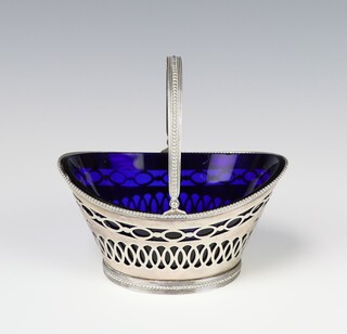 A Dutch pierced silver oval basket with swing handle and blue glass liner 119 grams, 12cm  