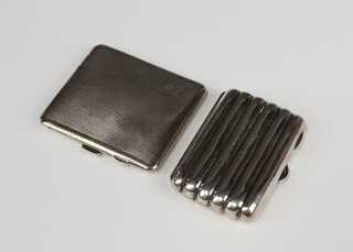 An Edwardian silver torpedo cheroot case with engraved inscription Birmingham 1902, an Art Deco silver engine turned cigarette case Birmingham 1933, gross weight 149 grams 