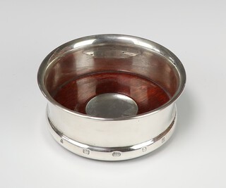 A circular silver coaster London 1957, 11cm 