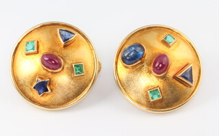 Theo Fennell, a pair of 18ct yellow gold etruscan style earrings set with rubies, emeralds and sapphires, the 2 cabochon cut rubies approx. 0.75ct, the cabochon cut sapphire 1.25ct, the 4 princess cut emeralds approx. 0.03ct, the 2 triangular sapphires approx. 0.3ct, the brilliant cut sapphire approx. 0.3ct, London 1991 gross weight 20 grams, 25mm 