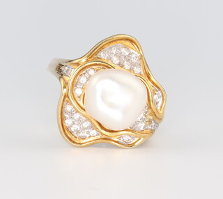 A yellow metal 585 natural pearl ring set with diamonds 7.6 grams, size O 1/2 