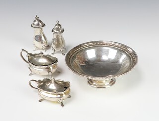 A 4 piece silver condiment set Birmingham 1921, 166 grams, together with a pedestal dish 