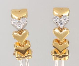 A pair of 18ct yellow gold diamond set heart earrings with safety clip to the back, the 6 brilliant cut diamonds each approx. 0.05ct, gross weight 11 grams (these are for pierced ears) 