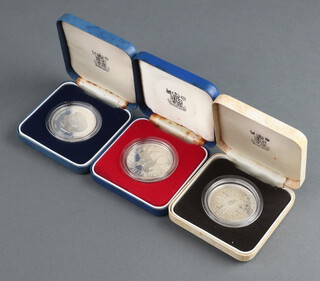 Three silver commemorative coins 1977, 1980 and 1981, 84 grams, cased  