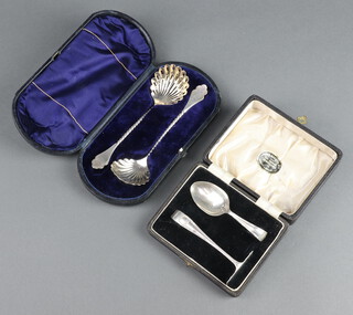 A silver pusher and spoon Birmingham 1934, 2 silver serving spoons Sheffield 1889, both cased 88 grams 