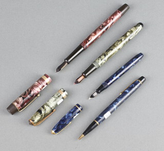 A child's Dinkie 550 blue fountain pen with 14k nib, a ditto propelling pencil, an Onoto green marbled fountain pen with 14ct gold nib and a ditto purple marble with 14ct nib 
 