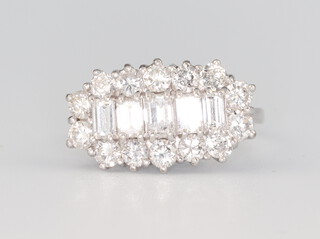 An 18ct white gold baguette and brilliant cut diamond cocktail ring, approx. 2ct, size N 1/2, 5.4 grams 