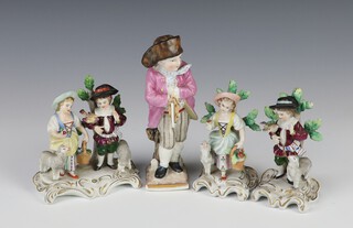 A pair of Sitzendorf figures of a girl and boy with sheep on Rococo bases 10cm (1 stuck, both are chipped), a ditto group of a boy and girl with sheep 11cm (chips to flowers) and a German figure of a standing boy 15cm 