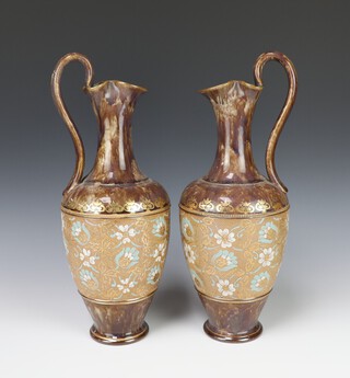 A pair of Doulton Slater ewers with floral decoration 34cm 